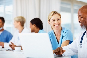 Doctors looking at a computer.